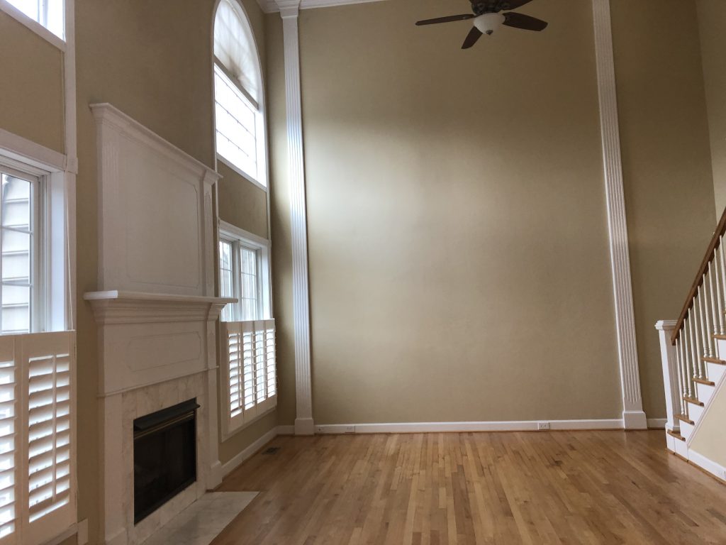 vaulted ceiling family room with fire place