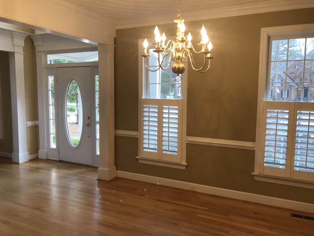 formal dining room with chandelier 