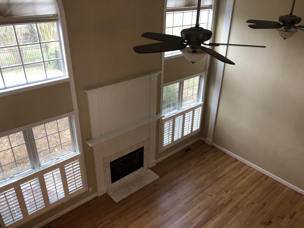 vaulted ceiling family room with fireplace 