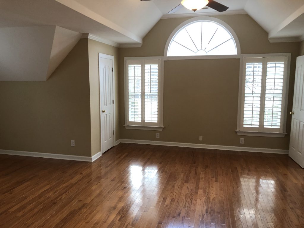 vaulted ceiling and hardwood floors